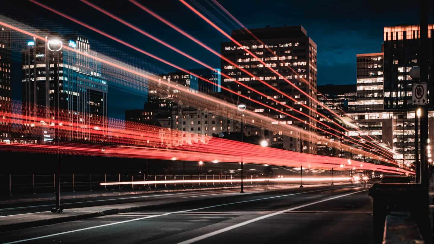 Image of a city center using long exposure to create red streaks ofr light